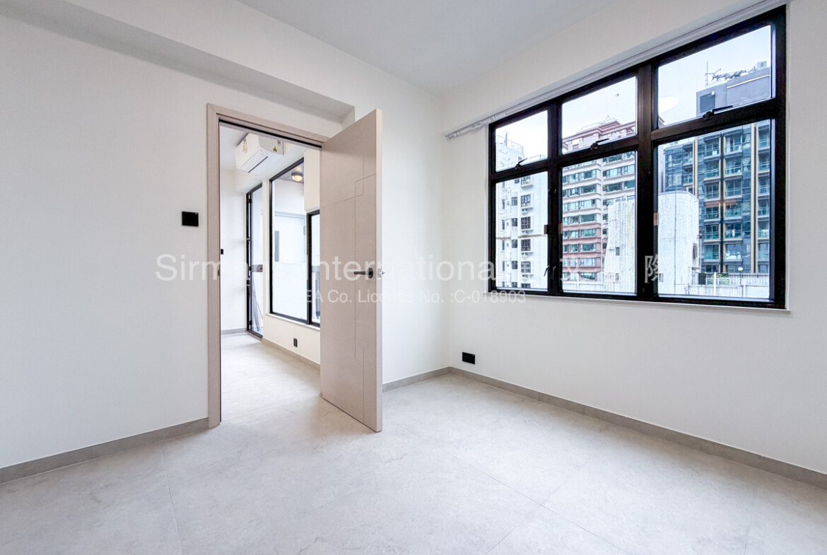 Empty room with large windows