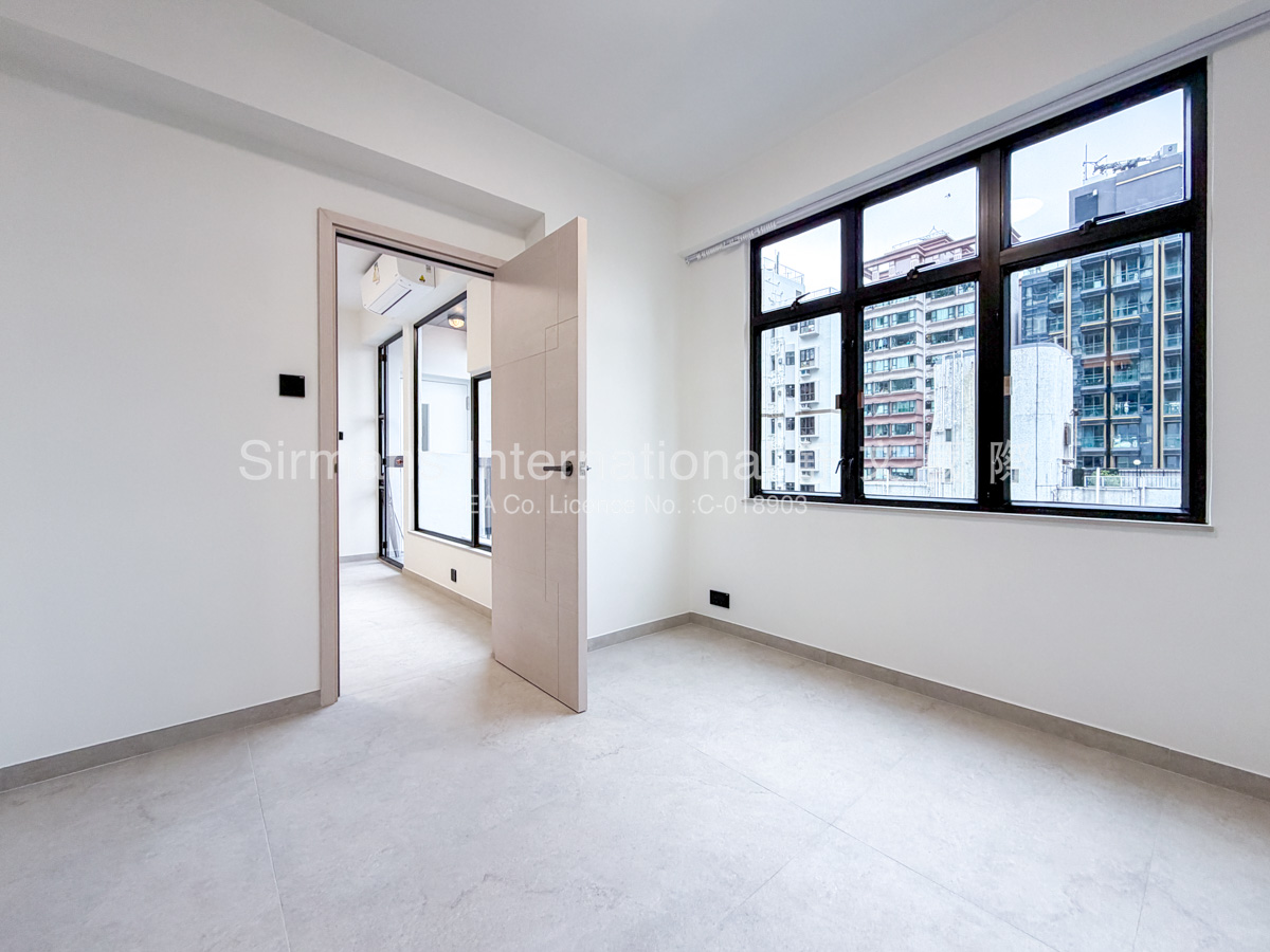 Empty room with large windows